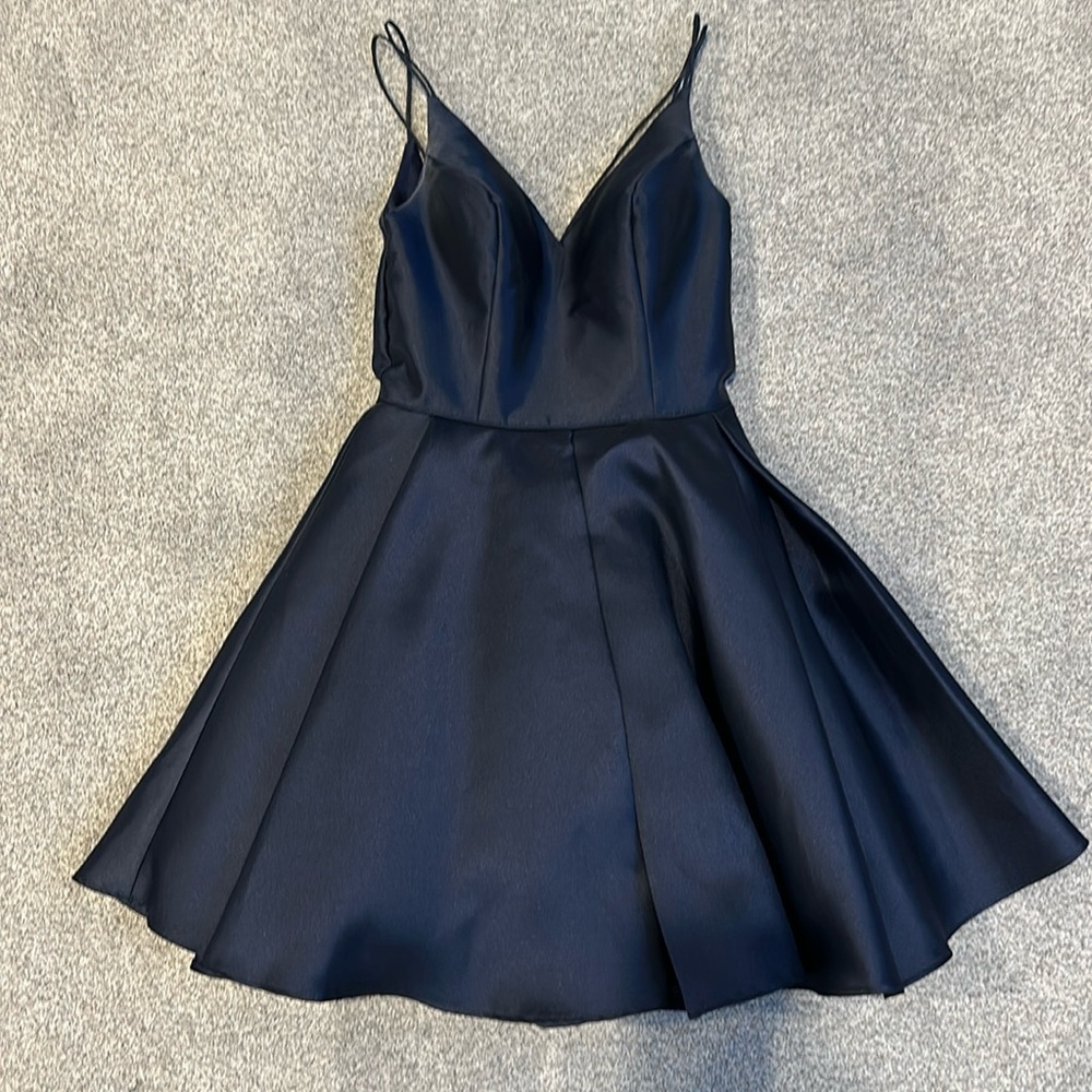 Navy satin dress w/ spaghetti straps. Tulle in the skirt for flair.